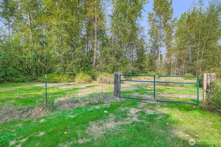 GATED PASTURE AREA AND WALKING TRAILS.