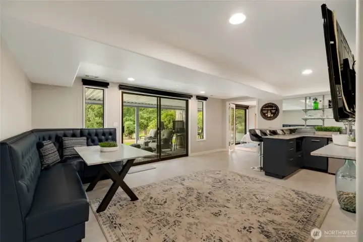 Lower-level entertainment space. Bench seat stays.
