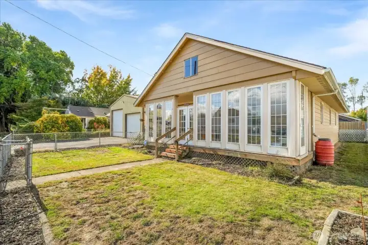 Beautiful windows to the enclosed front porch.
