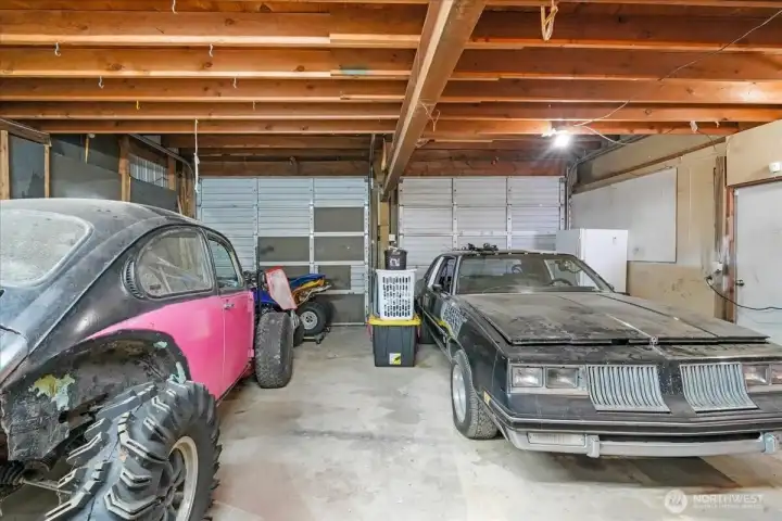 Rear side of shop. Two more parking spots or room for anything you can dream up.