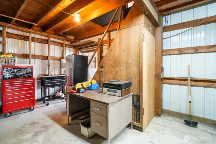 turn around view of the stairs to the upper storage area.