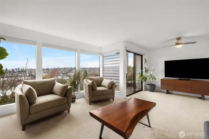 Entertain, unwind, and take in the views—this spacious great room opens to the balcony and the city beyond.