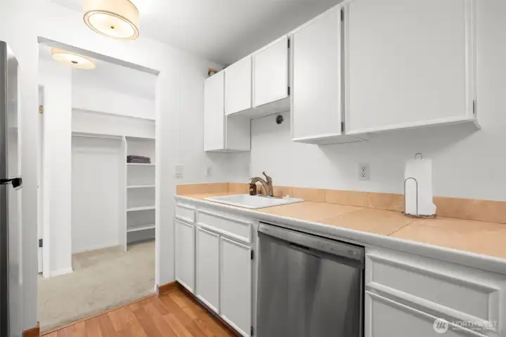 Bright, functional galley kitchen with generous storage space.