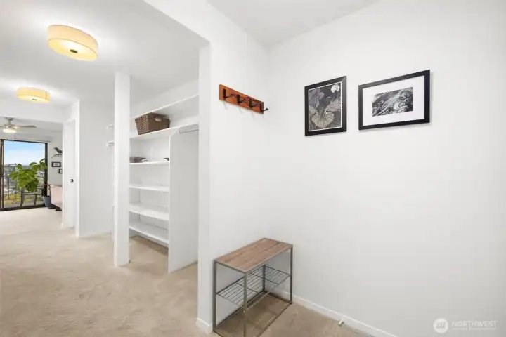 Where home begins—this chic entry hallway with built-in storage nooks keeps life beautifully organized.