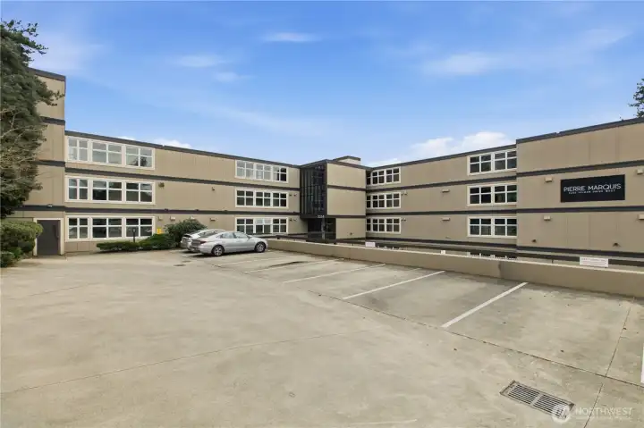 front view of building with the guest parking