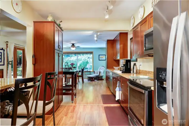 A view from the kitchen looking toward the additional dining space or family room.