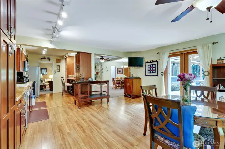 The view from the additional dining/family room space looking back toward the kitchen and dining room.
