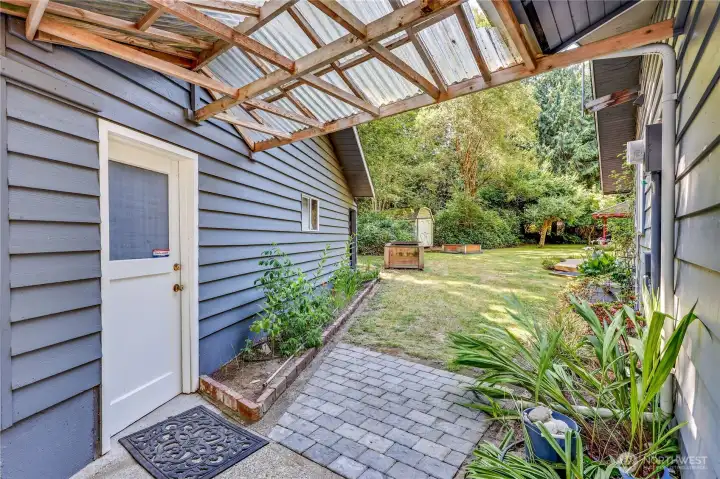 The man door access to the garage and the pass through to the back yard.