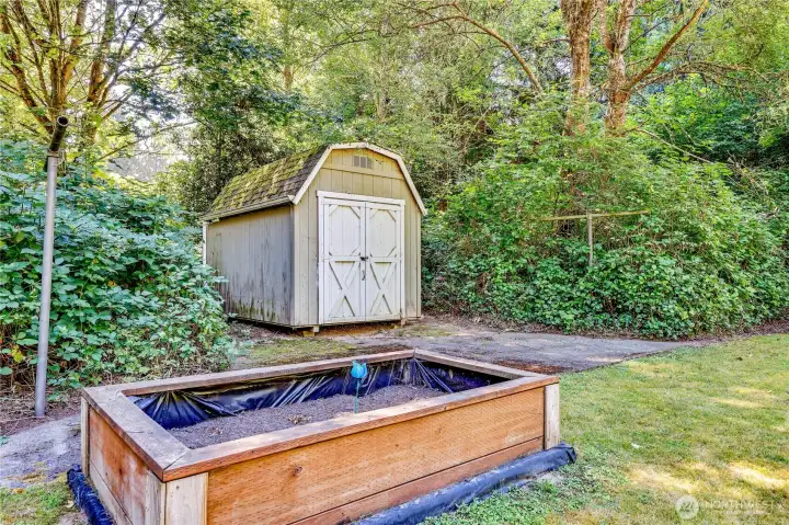 Raised beds and a storage shed for all your gardening tools.
