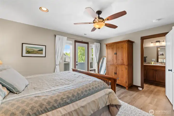 Primary bedroom has French door to deck.