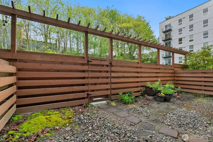 Backyard from patio with gate to reserved parking spot! Backyard from patio with gate to reserved parking spot!