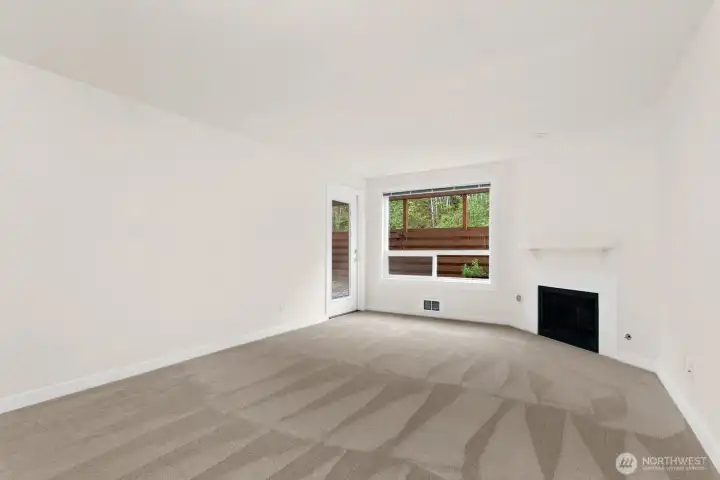 Dining room and living room with door to backyard. Dining room and living room with door to backyard.