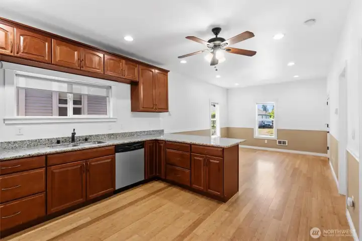 Big kitchen with plenty of cabinets, slab granite countertops and a great layout.