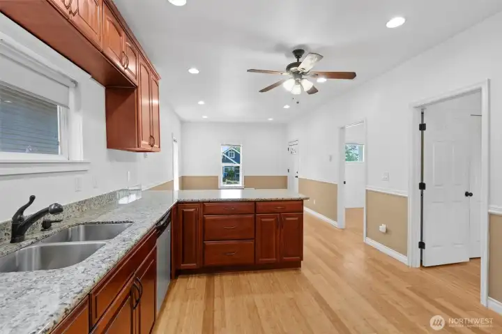Big kitchen with plenty of cabinets, slab granite countertops and a great layout.