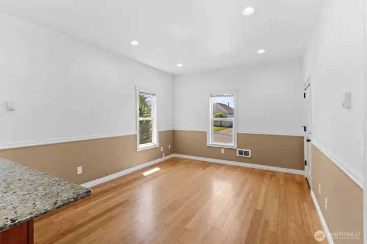 Nice living/dining room with loads of natural light and beautiful bamboo floor.