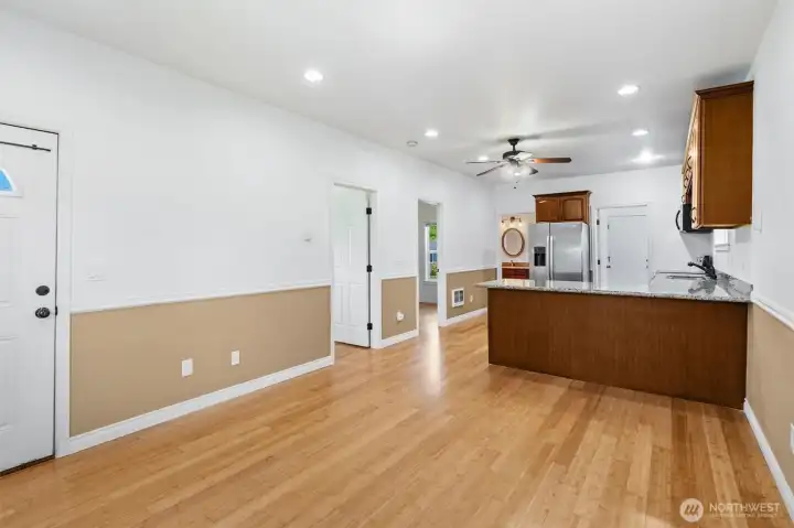 Nice living/dining room with loads of natural light and beautiful bamboo floor.