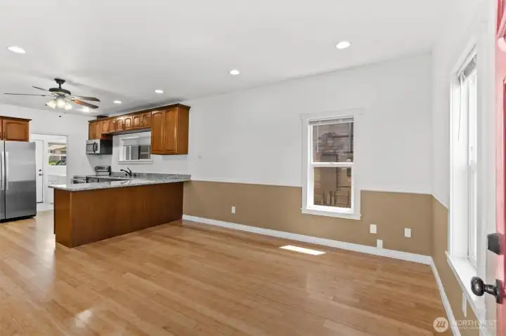 Nice living/dining room with loads of natural light and beautiful bamboo floor.