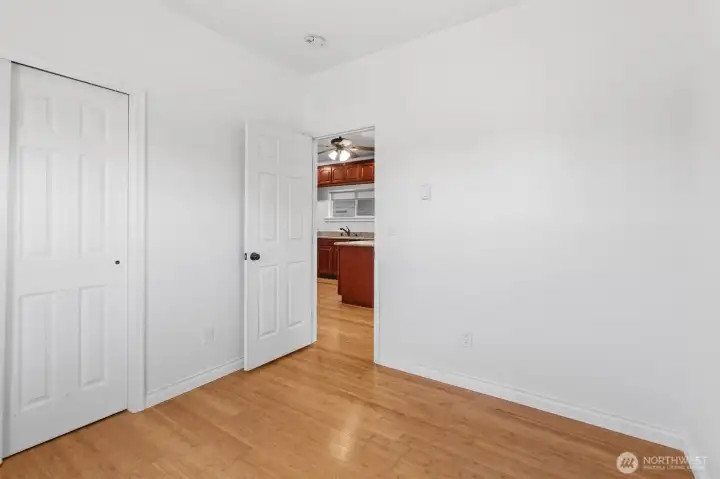 Primary bedroom with beautiful bamboo floors. This bedroom has views of the Cascade Mountains and Snohomish River.