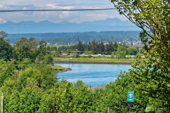 Views of the Cascade Mountains and Snohomish River from the primary bedroom.