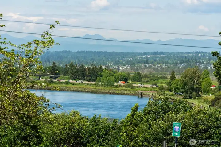Views of the Cascade Mountains and Snohomish River from the primary bedroom.