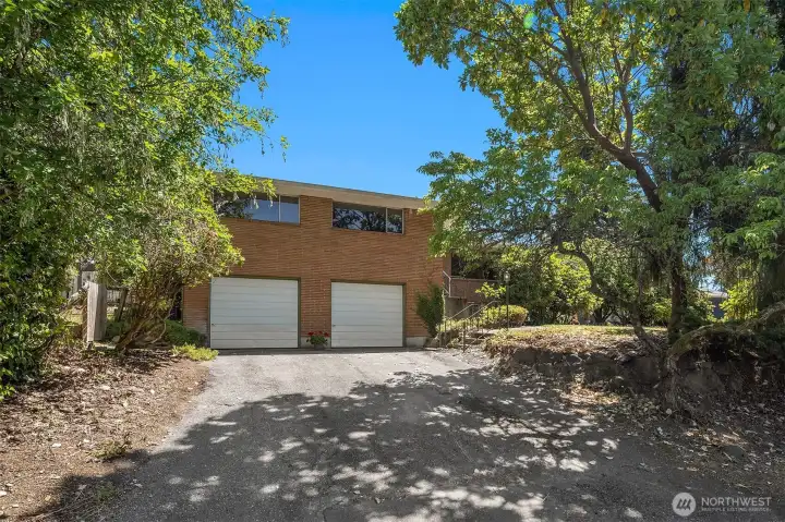 Oversized 2 car garage, big side yard to left
