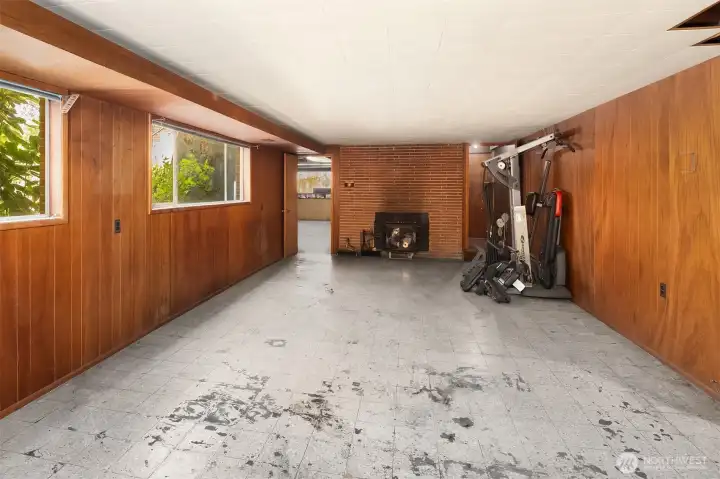 Downstairs Space with Wood Burning Insert in the Fireplace