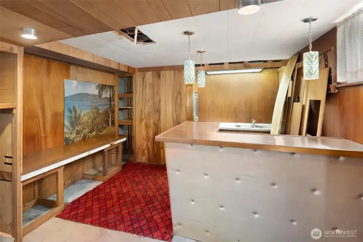 Bar/Kitchen Area in Dowstairs. There's a wall oven and sink