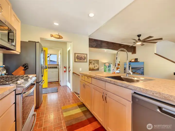 Open kitchen flows seamlessly into the dining and living areas. Open kitchen flows seamlessly into the dining and living areas.