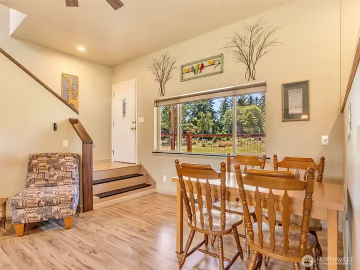 Dining area overlooking the yard with easy access to the main living spaces. Dining area overlooking the yard with easy access to the main living spaces.