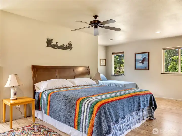 Spacious primary suite with vaulted ceilings and abundant natural light. Spacious primary suite with vaulted ceilings and abundant natural light.