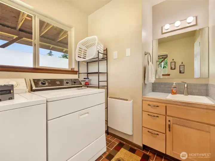 Dedicated laundry room with built-in storage and sink. Dedicated laundry room with built-in storage and sink.
