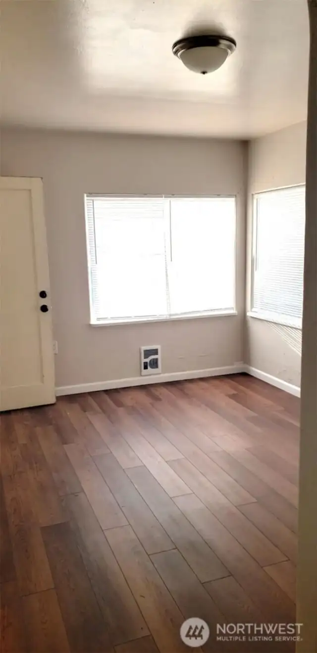 East facing upper unit provides natural morning light-updated flooring