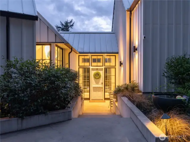 The entry welcomes you with a large dutch door and glass surround.