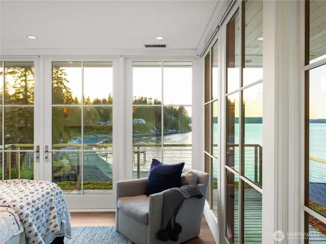 The primary suite with wraparound deck balcony. All windows have automatic blackout shades for the perfect night sleep.
