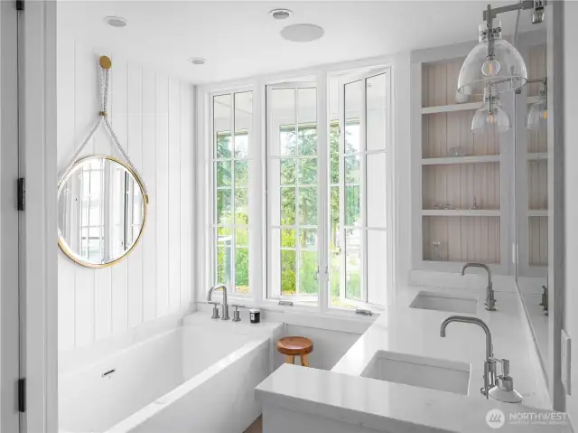 The primary bath with BainUltra tub, Quartz countertops and built-ins.