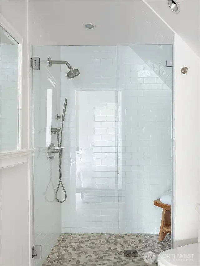 The second primary suite bathroom is beautifully adorned with heated floors. Every bathroom in the home has heated Toto washlet seats.