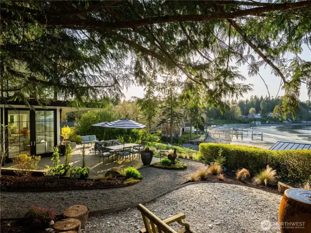 The side yard with a calming water feature is an incredible space to take in the setting sun.