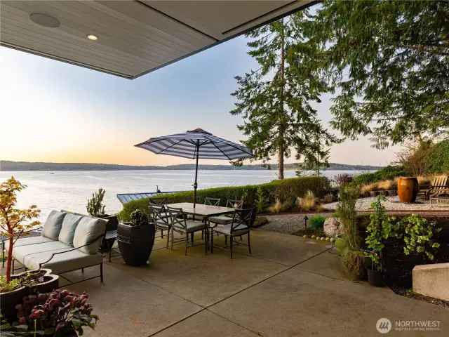 Warm light drenches the covered outdoor spaces as the sun begins to set.