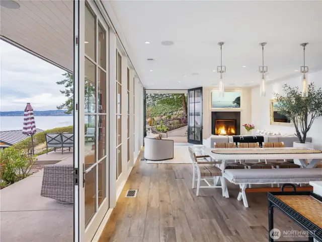 Step into the great room with kitchen, dining and living room and floor to ceiling Pella glass windows and doors for seamless transitions from inside to out.