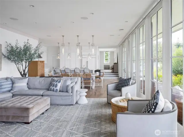The home is awash is natural light. View from the patio door back to the kitchen.