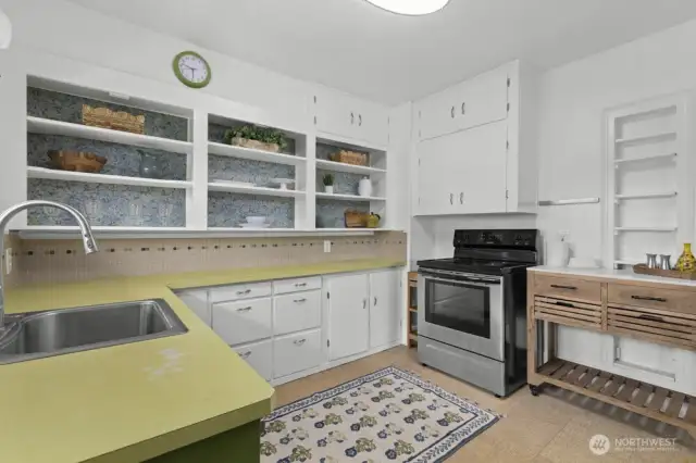 The kitchen offers a nostalgic nod to the past with vintage charm, plenty of functionality, and room to make it your own