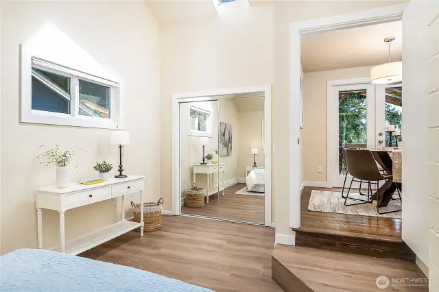 Primary bedroom has a large walk-in closet. The dining room is to the right.