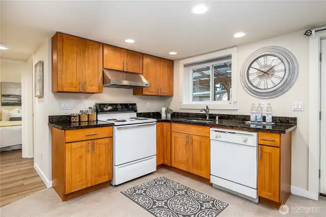Full sized kitchen downstairs is perfect for independent living or AirBnB/rental potential.