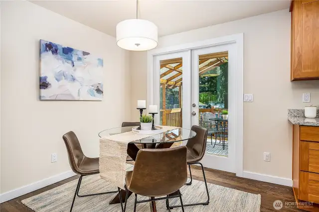 Dining area with French Doors leading to the covered patio outside.
