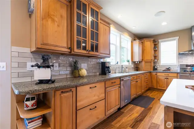 Beautiful tile backsplash accents the quartz counters.