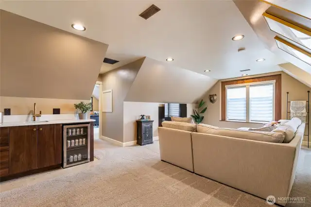 Upstairs bonus room with wet bar. Door leads to office/flex room or could be a bedroom.