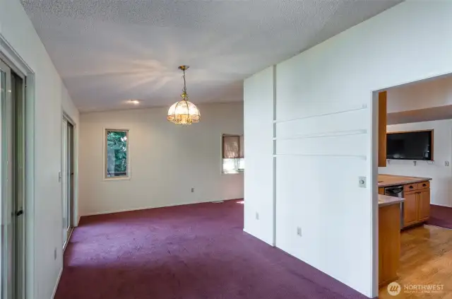 The dining area off the kitchen fits a table for 10. There is access to the main deck from here.
