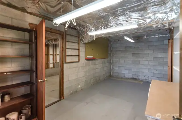 This is one of 2 partially finished rooms in the basement. Sellers used these rooms as their workshops.
