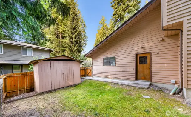 The side yard offers additional space with a handy storage shed and private gate access. Ideal for garden tools, bikes, or weekend projects.