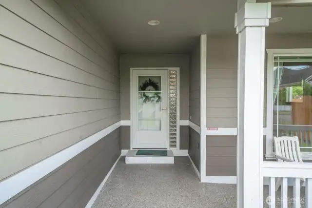 Welcoming front entry, with quality screen door that allows you to let the breeze in or shut the cold out.